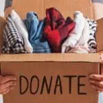 woman holding box of donations