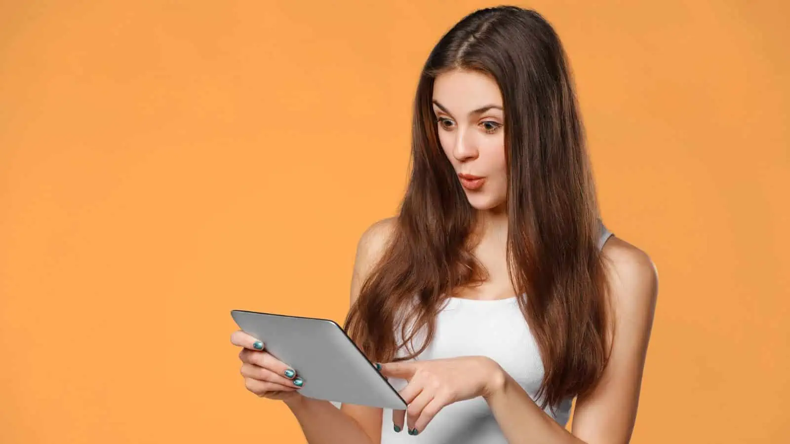 woman on tablet orange background