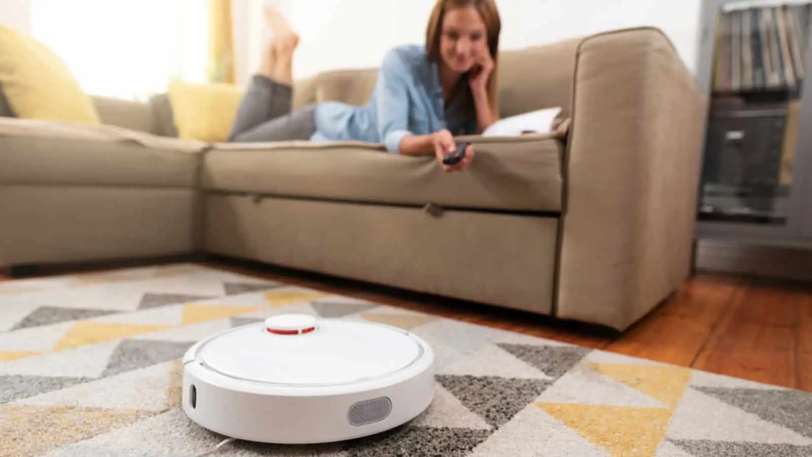 Woman using Robotic Vacuum