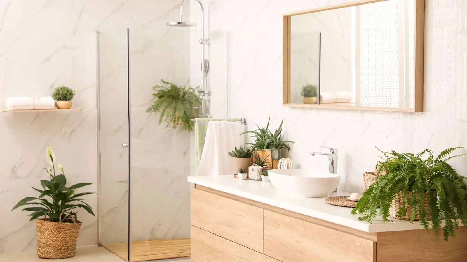 clean modern bathroom with marble and light wood