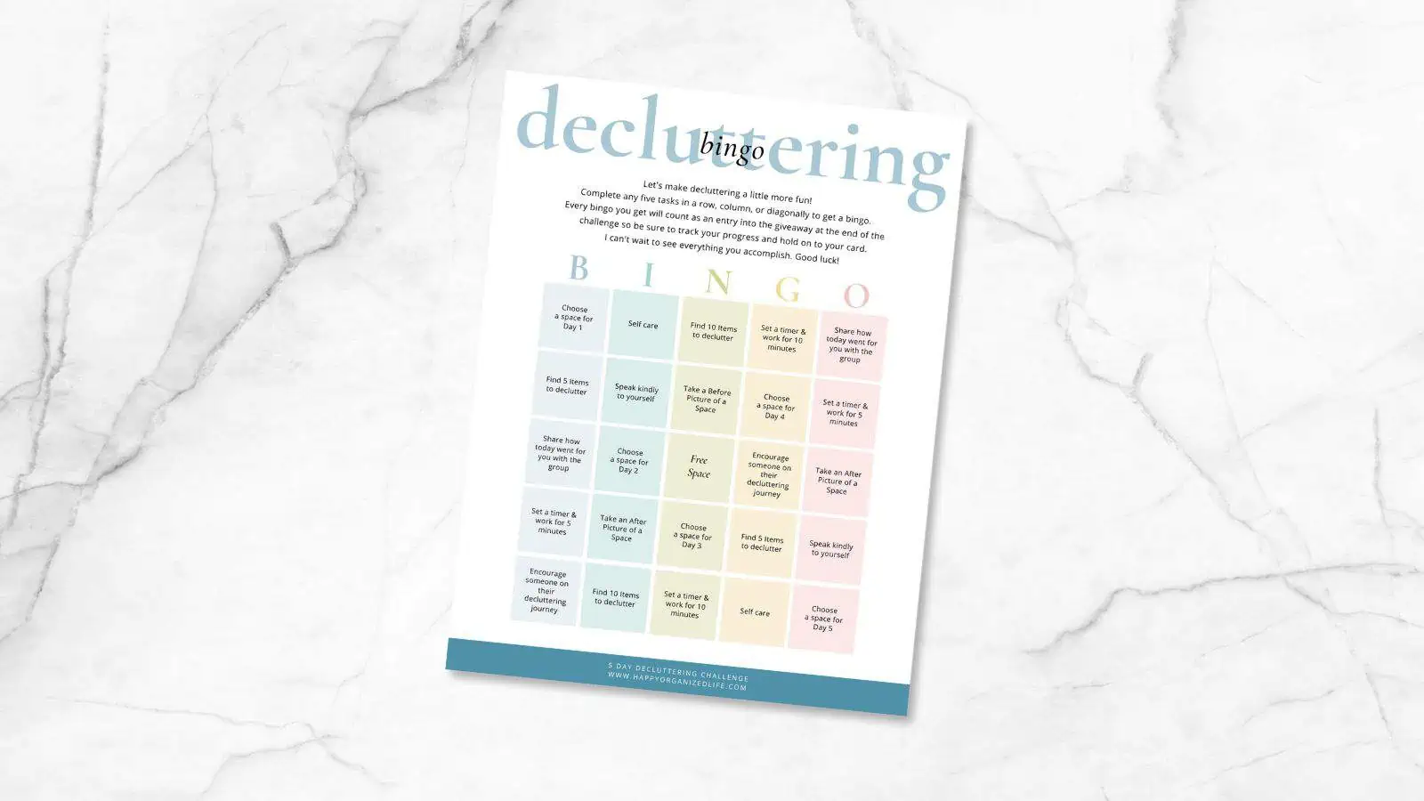 decluttering bingo card on marble