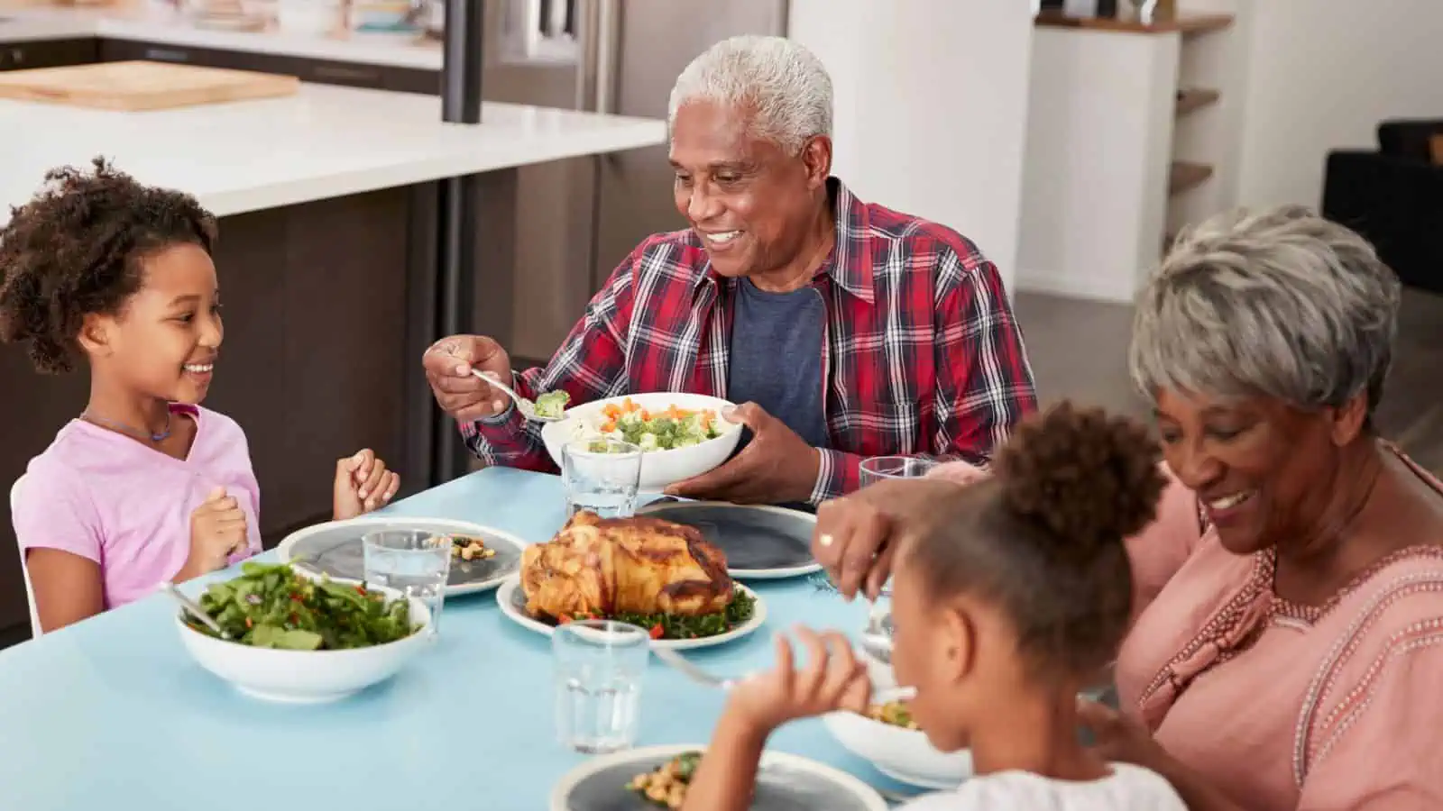 grandparents eating dinner with grandkids