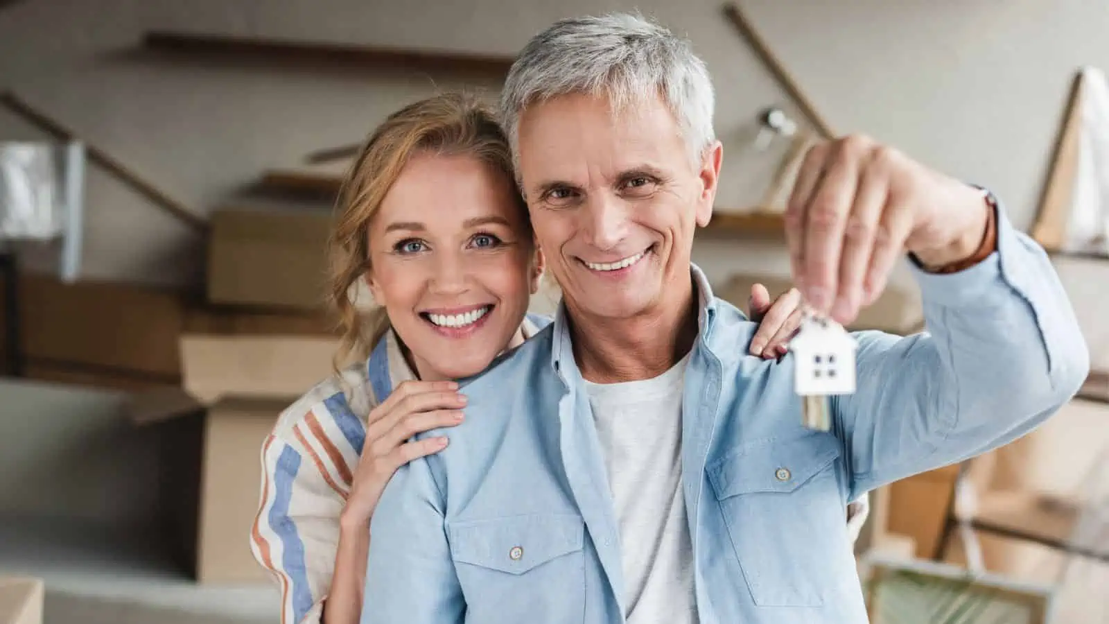 older couple with keys to new home