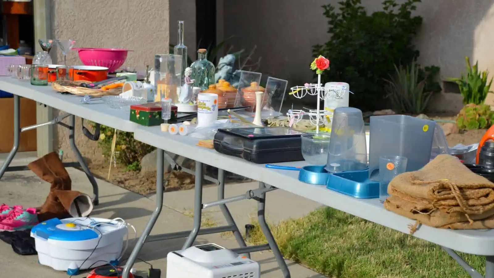 table of stuff for sale at a garage sale