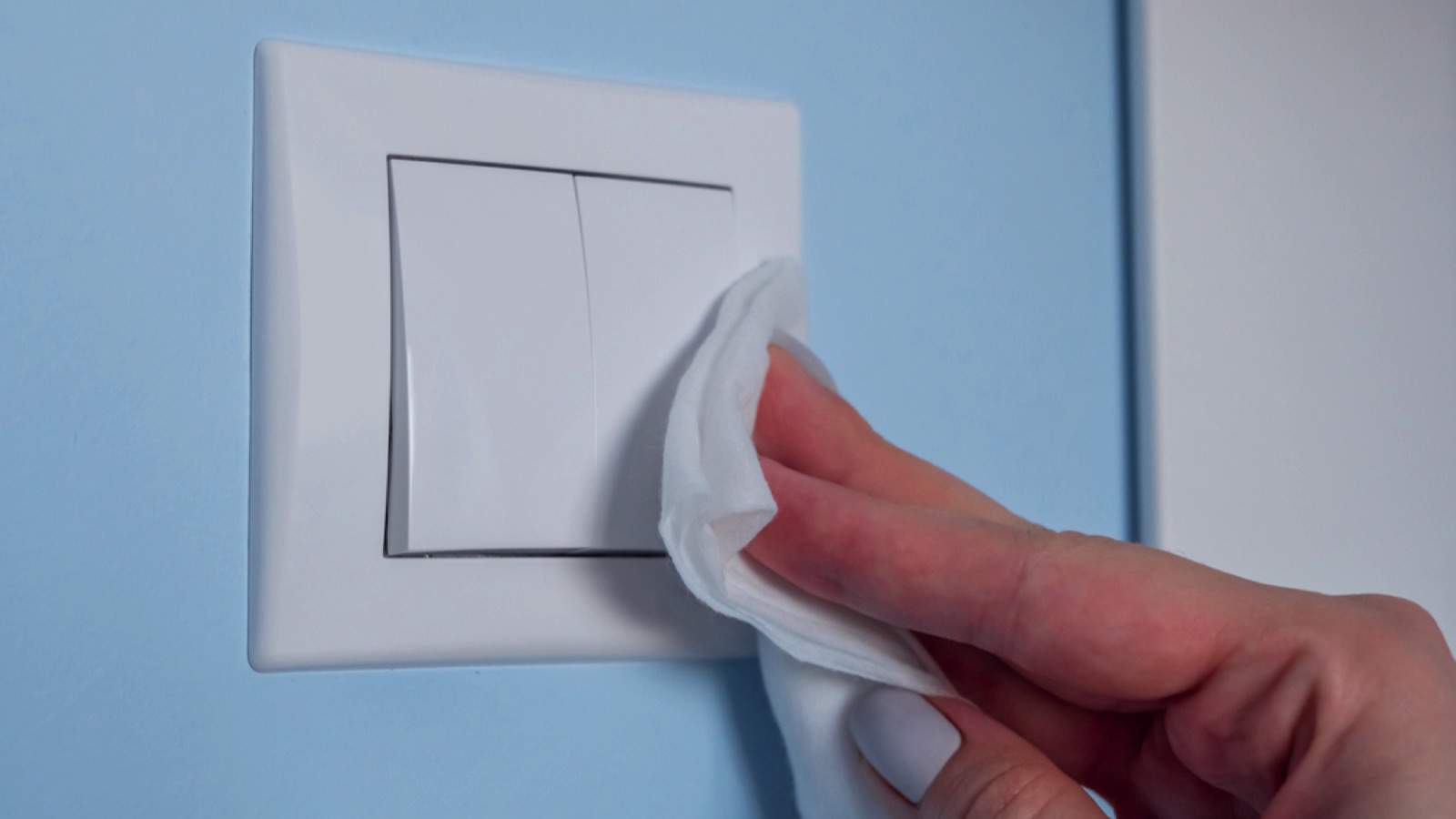 Woman cleaning Switch Plates