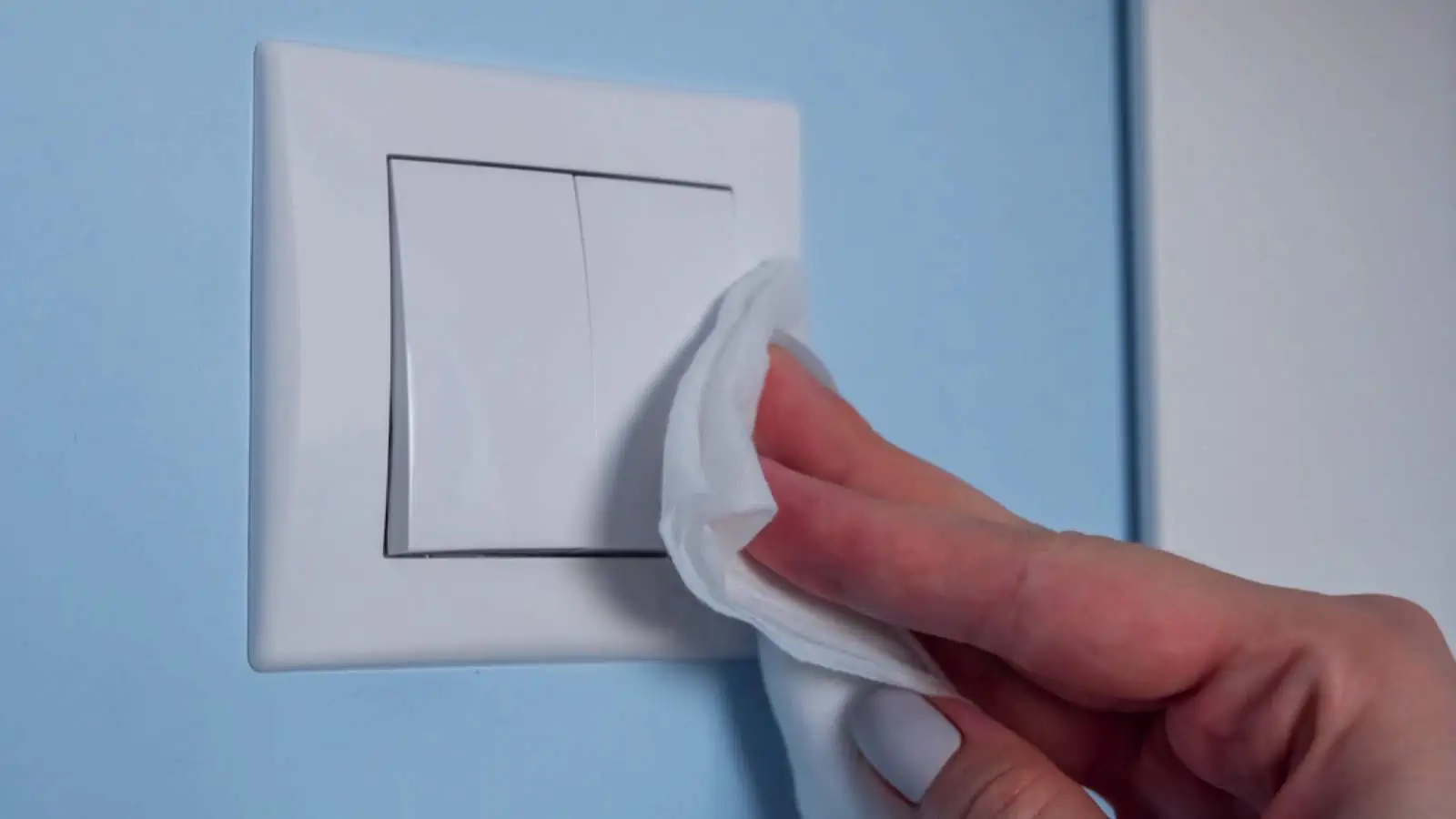 Woman cleaning Switch Plates