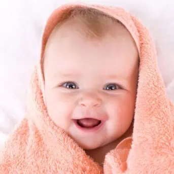 cute baby wrapped in towel